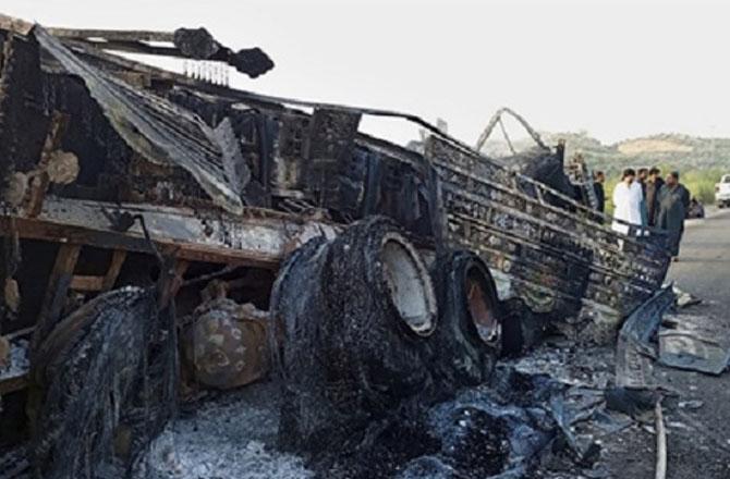 A bus burnt by terrorists. Photo: PTI