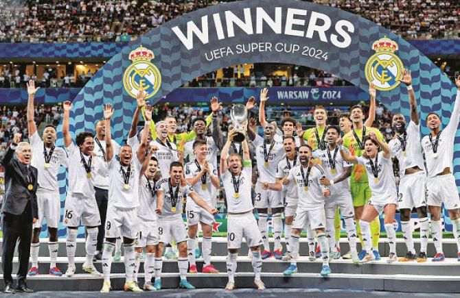 Real Madrid players can be seen celebrating with the trophy after beating Atalanta to clinch the title. Photo: Courtesy X