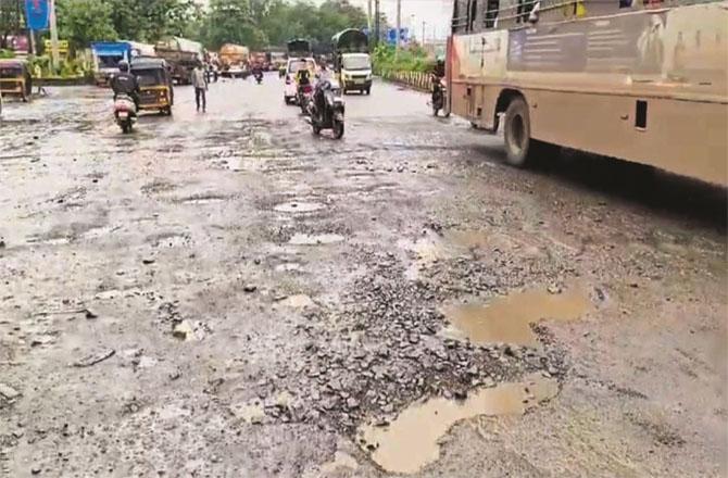 Potholes can be seen on the flyover of Shahad railway station.