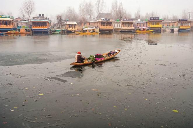 A beautiful view of the partially frozen Dal Lake in Srinagar. Photo: PTI