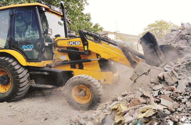 Work is underway to remove debris from the plot cleared for the cemetery.