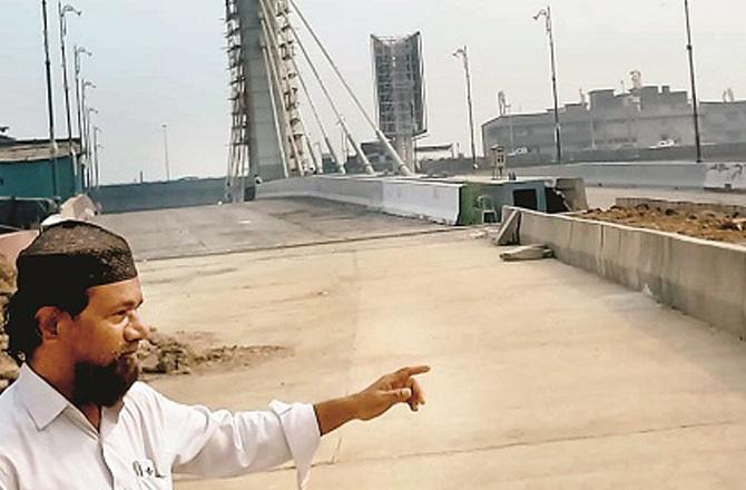 A local man talking about the problems caused by the construction of the Ray Road Cable Bridge. Photo: Iqbal