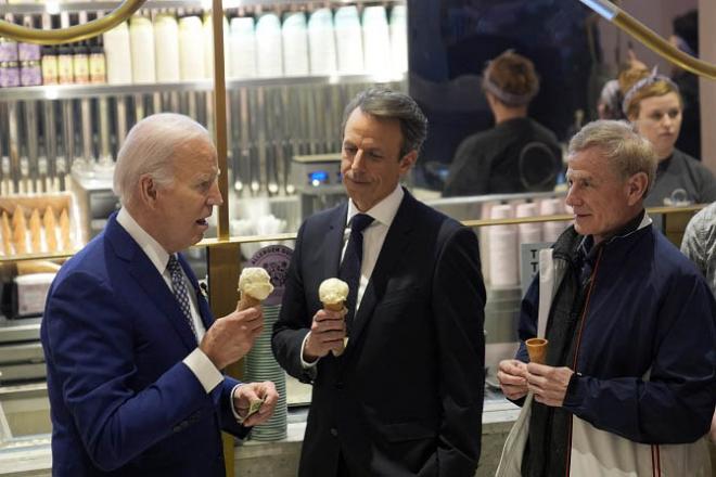 President Joe Biden talks with Seth Meyers, center, as he visits Van Leeuwen Ice Cream Monday. Photo: PTI