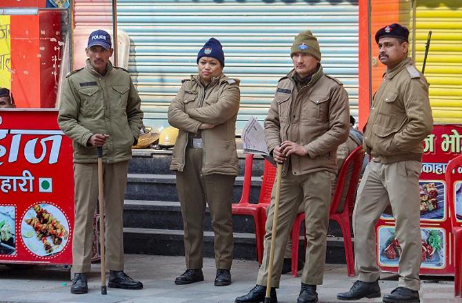 Police officers are deployed in the area during the curfew. Photo: PTI