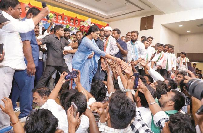 YS Sharmila among his supporters. Photo: INN