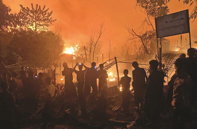 The Rohingya camp near Cox`s Bazar is engulfed in flames. Photo: PTI