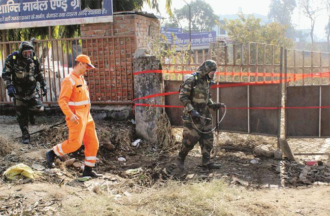 NDRF officials trying to stop the gas leak. Photo: PTI