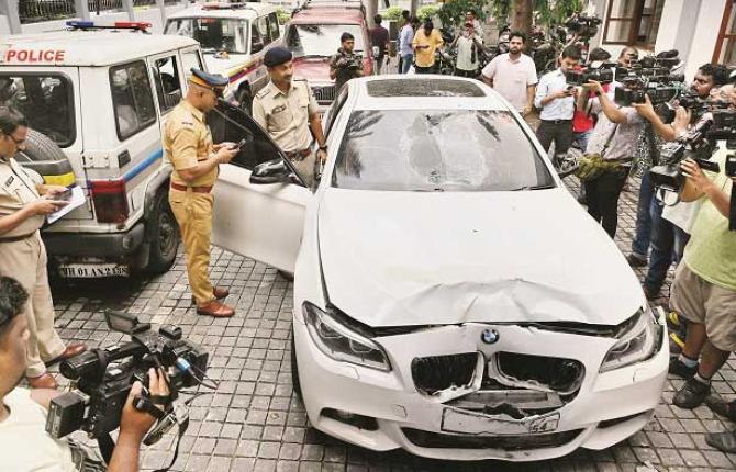 RTO officers inspecting the crashed BMW car at Worli Police Station. Photo: INN
