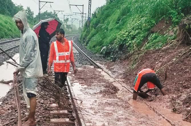 Debris is being cleared from the track near Autgaon station. Photo: INN