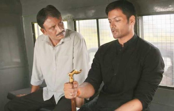 Ali Fazal and Rajesh Telang can be seen in a scene from the web series `Mirzapur 3`. Photo: INN