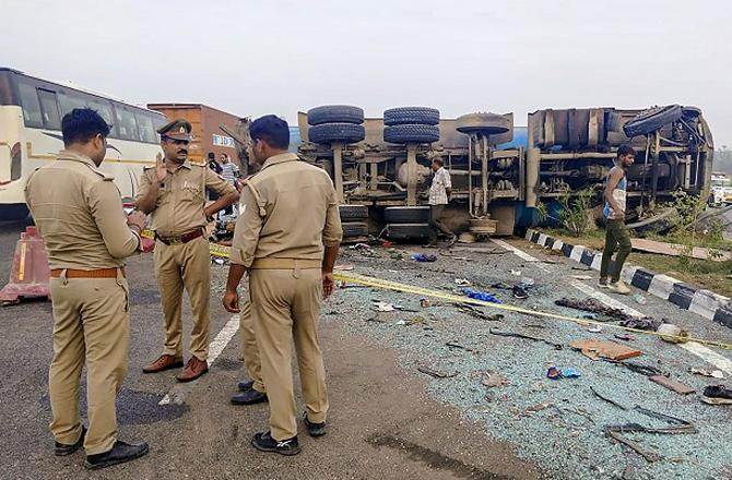 Police personnel can be seen at the scene. Photo: PTI