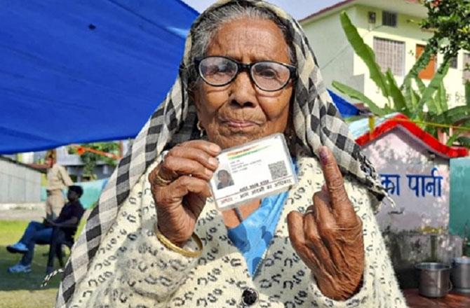An elderly woman exercising her right to vote in the Uttarakhand by-election. Photo: PTI