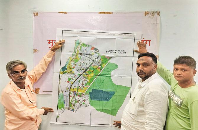 People involved in the press conference showing the reserve plot map for Vikhroli cemetery. Photo: Inquilab