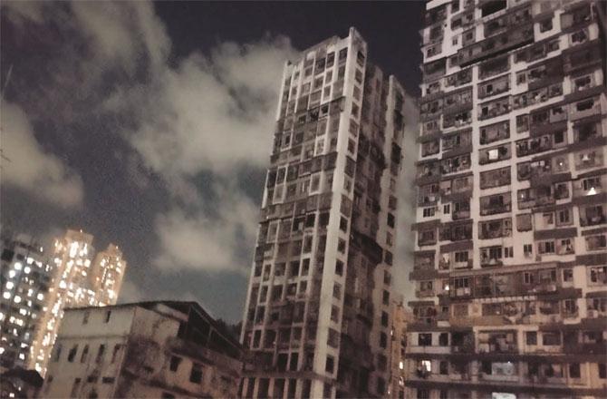 Due to lack of electricity, the multi-storied building of Madanpura is seen in darkness. Photo: Inquilab