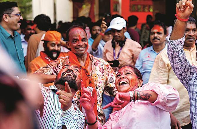 Party workers celebrating the success of their candidate. Photo: PTI