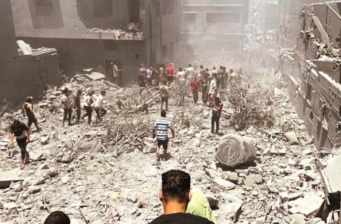 The scene after the Israeli bombardment of a residential building on Saturday. Photo: INN