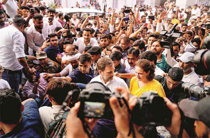 Rahul Gandhi and Priyanka Gandhi going for a press conference at the party headquarters during the announcement of election results. Photo: PTI