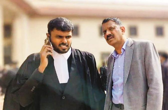 Anil Masih with his lawyer who was held responsible by the Supreme Court for rigging votes in the Chandigarh election. Photo: INN