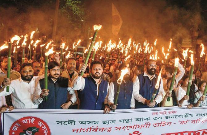 30 organizations including All Assam Students Union took out a torch march in Guwahati and protested. Photo: PTI