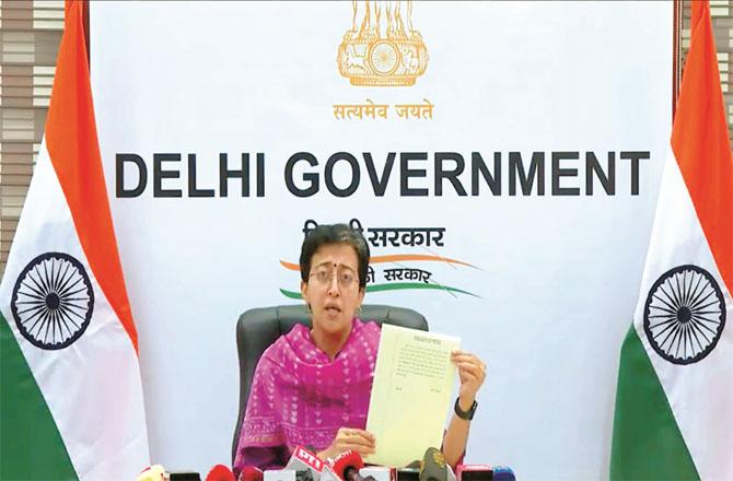 Senior AAP member and Delhi Minister Atashi showed the official order to the media. Photo: PTI