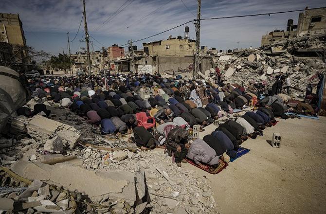 Praying in the ruins of a Palestinian mosque. Photo: PTI