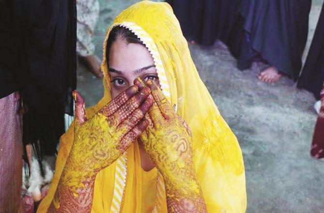 Rafiq Mansoori`s daughter, 19-year-old Misbah Haldi, during the ceremony