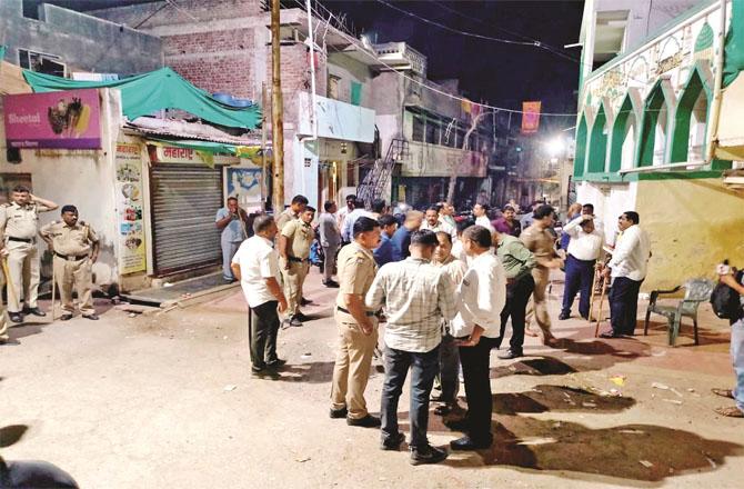 Police stationed near the mosque located in Sharsoli town of Jalgaon . Photo: Inquilab