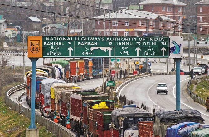 Queues of trucks formed due to closure of Srinagar-Jammu National Highway. Photo: PTI