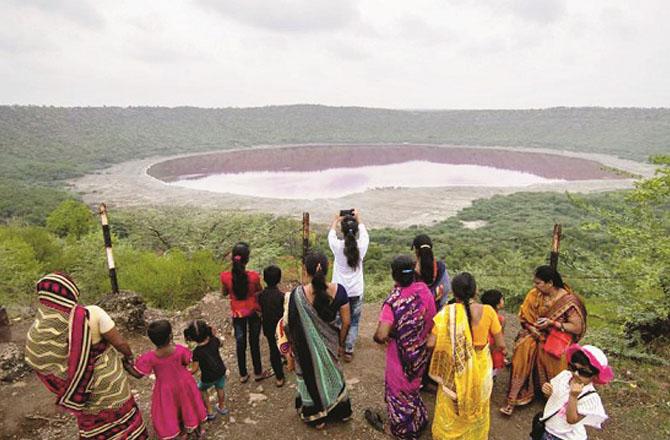 Tourists are seen near Lہnar Lake. Photo: INN