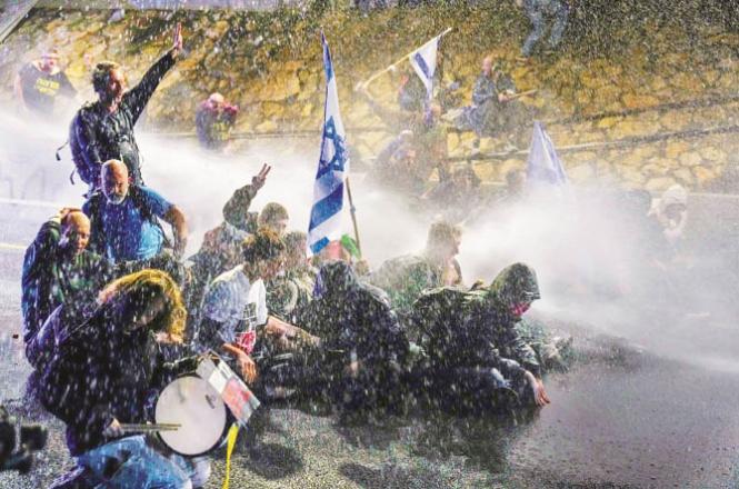 Water is being used to disperse the protesters in Israel. Photo: AP/PTI
