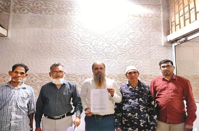 Members of the delegation showing the copy of the complaint made against Member of Assembly Nitish Rane. Photo: INN