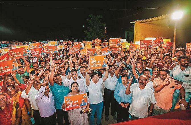 Pro-BJP voters in Goa with the state health minister. Photo: PTI