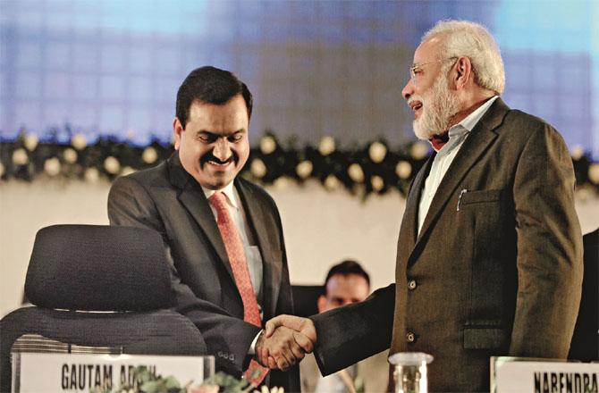 Forced to speak against you: Narendra Modi and Gautam Adani. Photo: INN