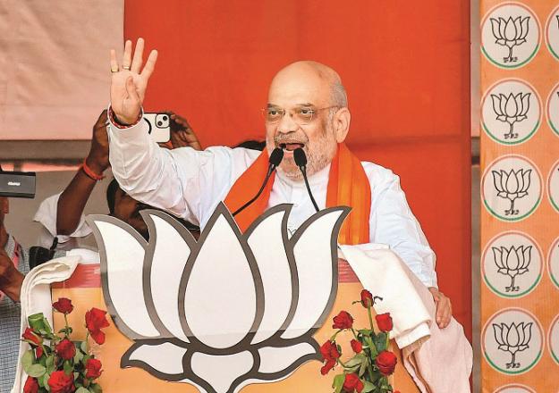 Home Minister Amit Shah speaking at Prayagraj. Photo: PTI