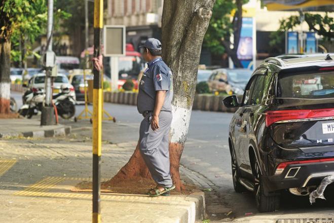 A clean-up marshal is seen near the Gateway of India. Photo: Atul Kamble