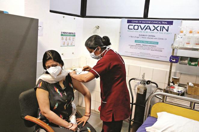 A woman getting a `Covexin` shot at a hospital. Photo: INN