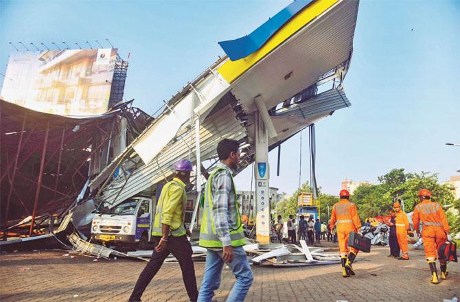 After a hoarding fell on a petrol pump in Ghatkopar, the pump was completely destroyed. Photo: PTI