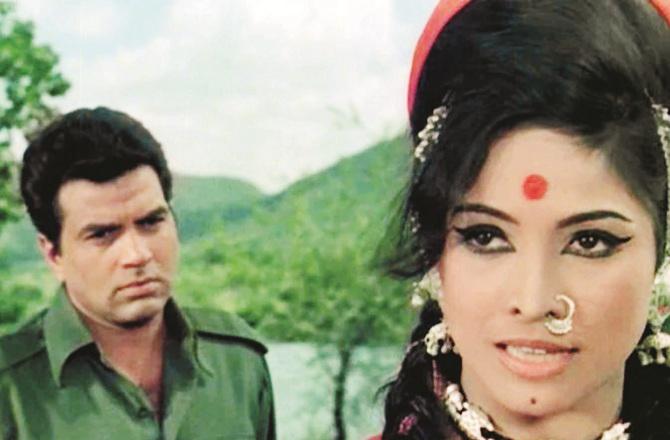 Actress Laxmi Chaya with Dharmendra in a film scene. Photo: INN.
