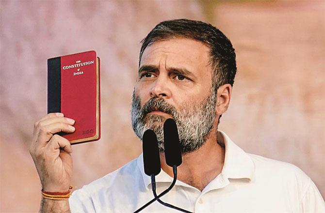 Rahul Gandhi showing the copy of the Constitution. Photo: PTI