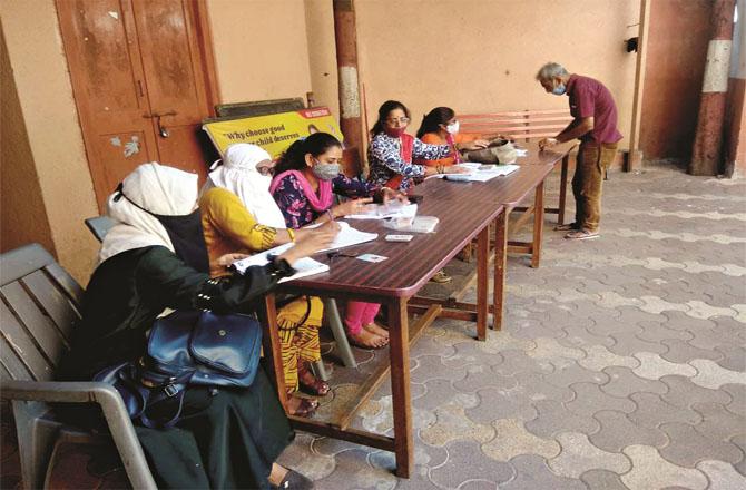 Teachers performing BLO duty at the polling booth.  Photo: INN