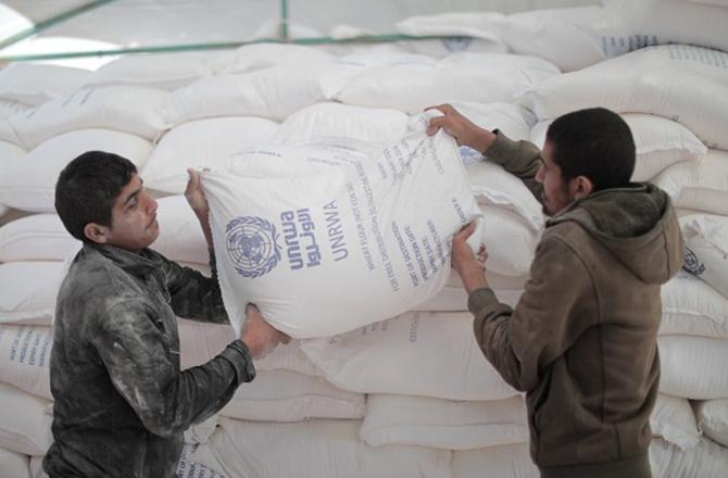 UNRWA workers distributing aid. Image: X