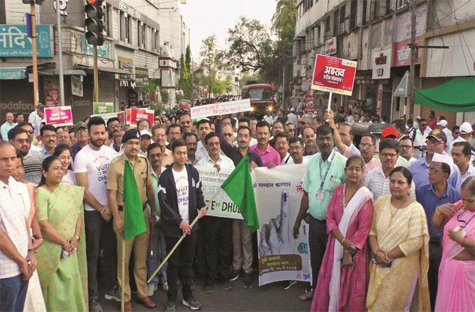 The District Collector can be seen flagging off the voter awareness rally. Photo: INN