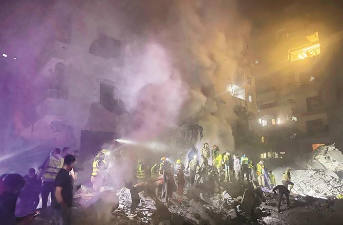 Victims are being searched in the rubble after an Israeli attack in Beirut. Photo: PTI.