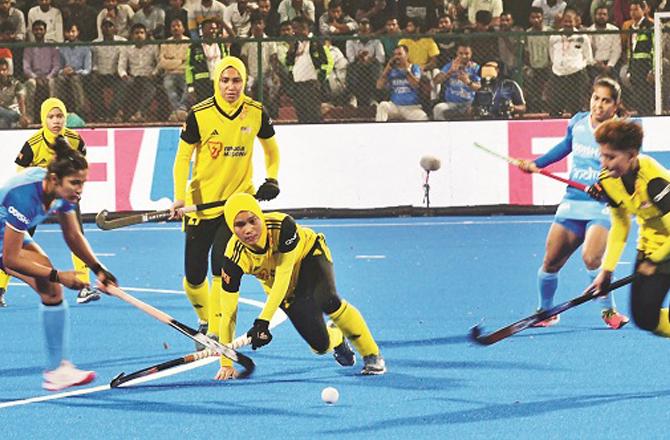 A player from Team India can be seen attempting a goal. Photo: PTI.
