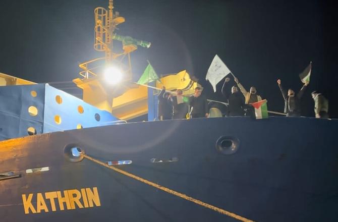 Turkish workers wave a Palestinian flag on the MV Kathrin. Image: X