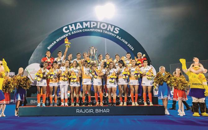 Indian women`s hockey team players can be seen jubilant with the trophy after winning against China in the final. Photo: INN