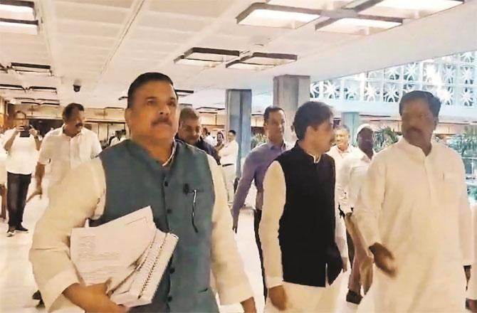 Sanjay Singh, a member of the Joint Parliamentary Committee on the Waqf Bill, and other members walking out of the meeting. (Photo: PTI)