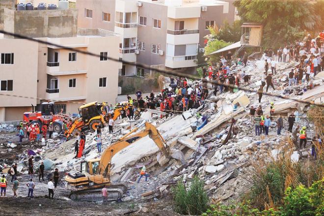 In Beirut, the capital of Lebanon, people are being searched for by removing the rubble of the destroyed building in the Israeli attack. Photo: PTI