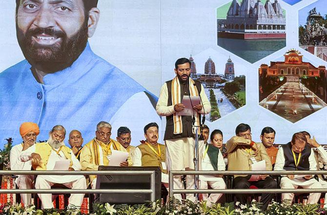 Naib Singh Saini taking oath. Photo: PTI