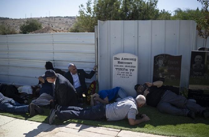 Israelis seeking asylum after the sirens went off. Photo: PTI